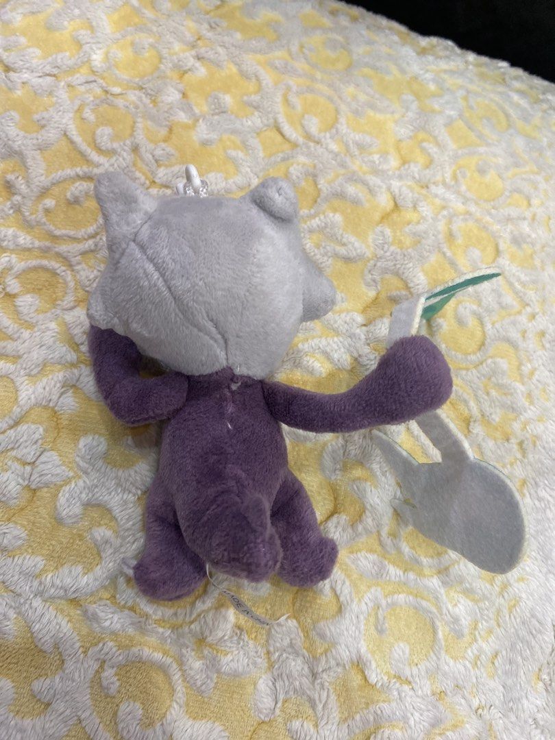 Alolan Marowak Pokemon plush keychain (Category: Plushies & Soft Toys) located in Manila. Submitted by j9e0fri_2025 (Listing ID 1470102305, Image 2). Description: - Purple Alolan Marowak plush keychain - Holding its signature bone club - Soft fabric body with embroidered facial details - Equipped with a white plastic clip for easy hanging.