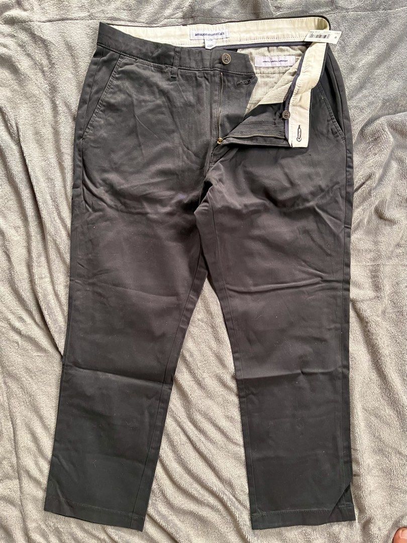 Amazon Essentials Athletic Fit Chino Pants Black (Category: Trousers) located in Urdaneta. Submitted by m1k3yl (Listing ID 1470025848, Image 1). Description: - Brand: Amazon Essentials - Item: Men's Chino Pants - Color: Black - Fit: Athletic fit with button closure and zipper fly - Condition: Brand new with tags attached - Features: Stylish white fabric-lined waistband and clear interior sizing tag.