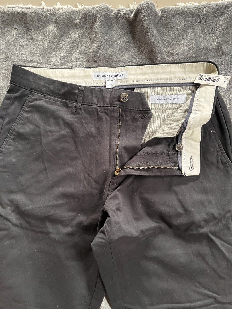 Amazon Essentials Athletic Fit Chino Pants Black (Category: Trousers) located in Urdaneta. Submitted by m1k3yl (Listing ID 1470025848, Image 2). Description: - Brand: Amazon Essentials - Item: Men's Chino Pants - Color: Black - Fit: Athletic fit with button closure and zipper fly - Condition: Brand new with tags attached - Features: Stylish white fabric-lined waistband and clear interior sizing tag.