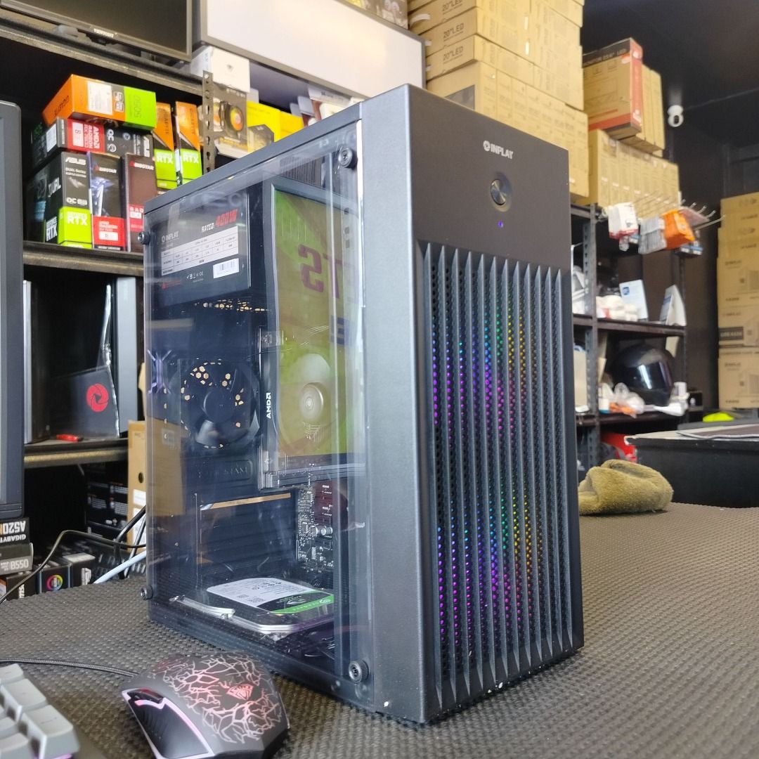 AMD RYZEN 3 3200G COMPUTER PACKAGE (Category: Desktops) located in Cavite. Submitted by jerickher83429 (Listing ID 1470034731, Image 3). Description: AMD RYZEN 3 3200G COMPUTER PACKAGE - Complete black desktop setup ready for gaming or office work - Sleek tower featuring RGB intake fans, glass side panel, and visible internal components - Includes a crisp display monitor - Equipped with a responsive grey mechanical keyboard - Comes with a precisi