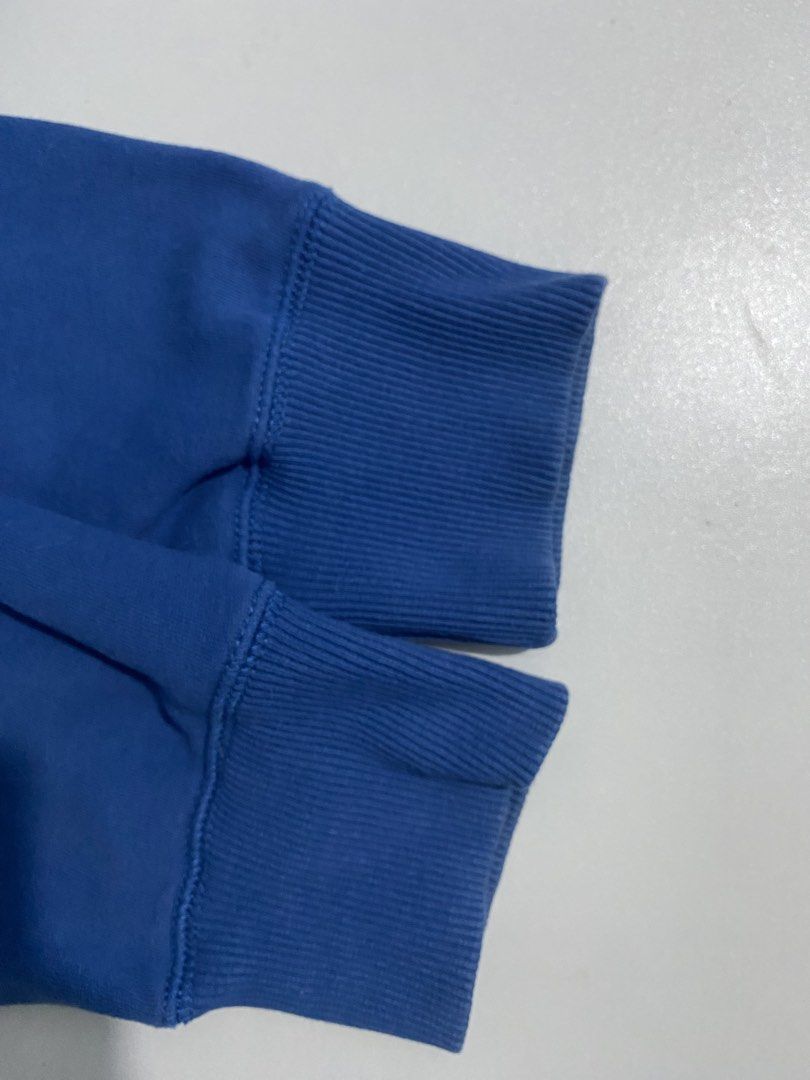 American Eagle Blue a.eagle Hoodie (Category: Coats, Jackets and Outerwear) located in San Pablo. Submitted by gt_vault (Listing ID 1470124099, Image 3). Description: Ready to wear Width: Length: Color rate: 8.5/10 Condition: Good Issue: None - Brand/Style: Authentic American Eagle hoodie in a vibrant blue color - Size: Medium with a comfortable classic fit - Design: Bold white A.EAGLE text graphic printed across the chest - Features: Adjustable 