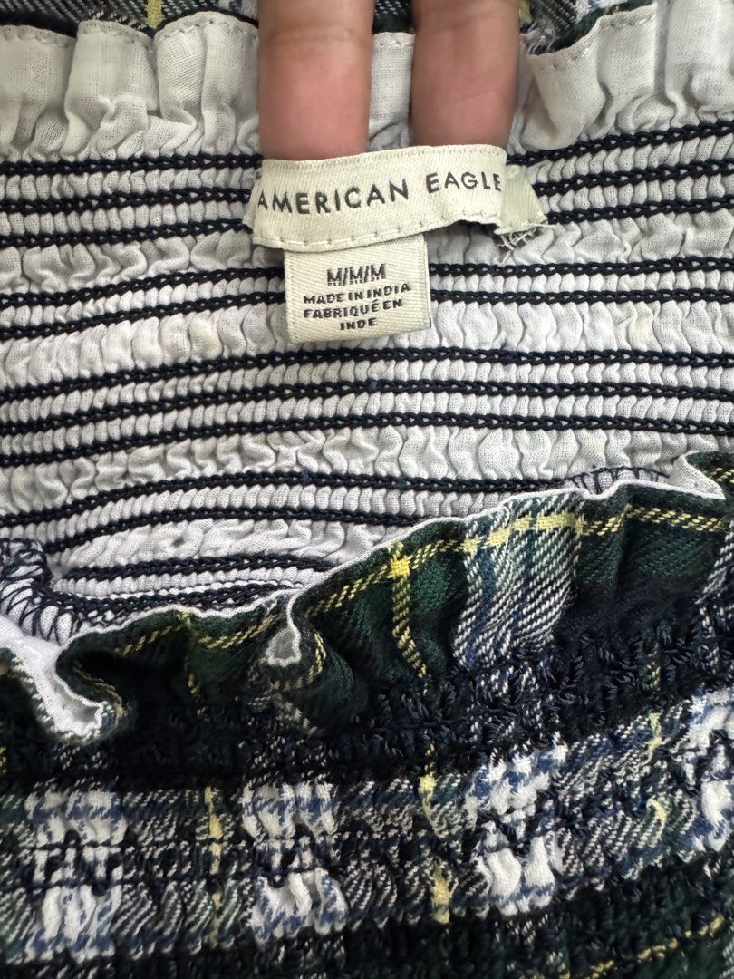 American Eagle Plaid Smocked Dress Size M (Category: Dresses) located in Dagupan City. Submitted by truehawk.c51029 (Listing ID 1470090065, Image 2). Description: - Brand: American Eagle - Size: Medium - Color/Pattern: Green, white, and black plaid - Design: Short puff sleeves, square neckline - Style: Comfortable and perfect for casual everyday wear.