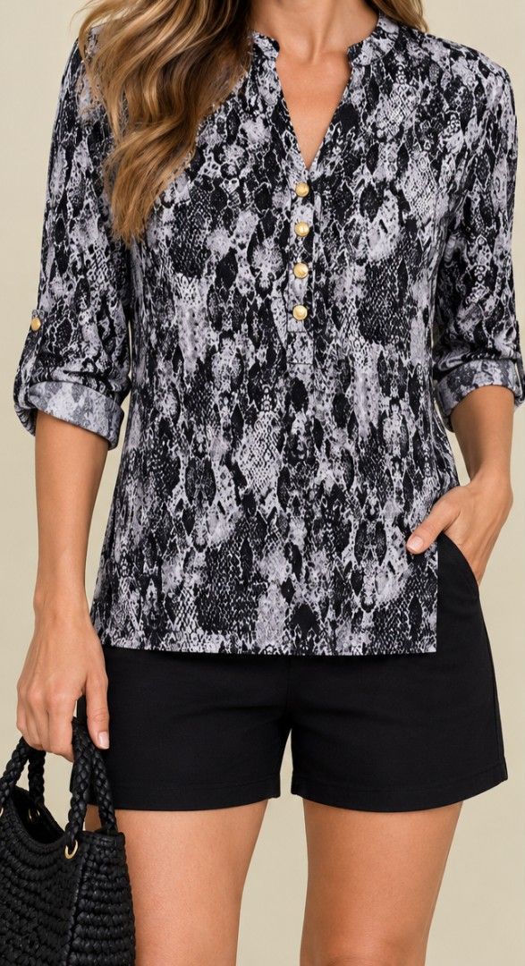 Anne klein snake skin pattern blouse medium - large zara mango T10 (Category: Blouses) located in San Pablo. Submitted by allyourbrandedneeds (Listing ID 1469969477, Image 1). Description: - Brand: Anne Klein - Design: Black & white snake print - Details: Gold-toned logo buttons, collar neckline - Sleeves: Three-quarter with roll-tab cuffs - Fit: Regular fit, standard length - Fabric: Lightweight, versatile for work or casual wear.