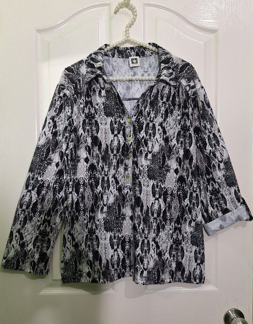 Anne klein snake skin pattern blouse medium - large zara mango T10 (Category: Blouses) located in San Pablo. Submitted by allyourbrandedneeds (Listing ID 1469969477, Image 2). Description: - Brand: Anne Klein - Design: Black & white snake print - Details: Gold-toned logo buttons, collar neckline - Sleeves: Three-quarter with roll-tab cuffs - Fit: Regular fit, standard length - Fabric: Lightweight, versatile for work or casual wear.