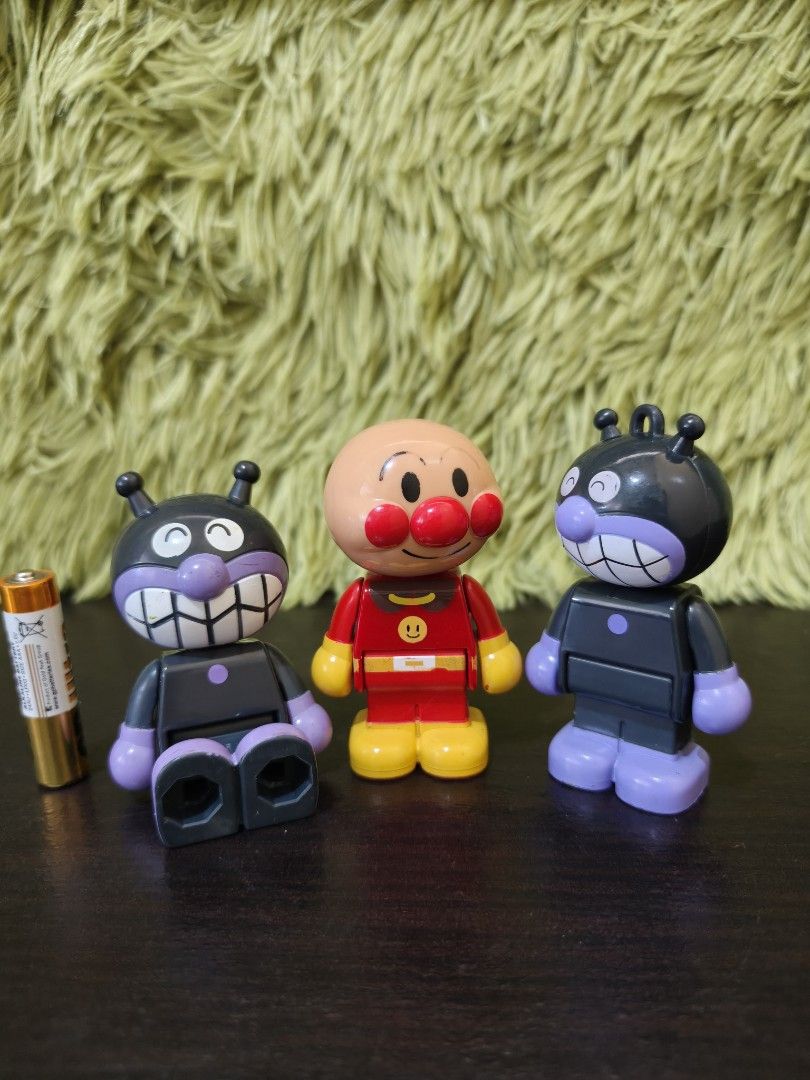 Anpanman and Baikinman Figures Set (Category: Figurines & Statues) located in La Trinidad. Submitted by charlsensei (Listing ID 1469966960, Image 1). Description: - Set of 3 collectible anime figures - Includes 1 Anpanman (red/yellow outfit) and 2 Baikinman (1 standing, 1 sitting) - Stands approximately 3 inches tall each - Features stamped copyright text and screw attachments on the back.