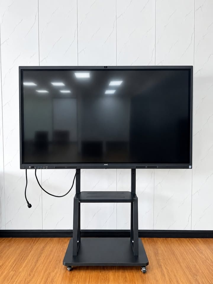 AOC Interactive Touch Screen Display with Mobile Stand (Category: Monitor Screens) located in Paranaque City. Submitted by digitalconcept.corp (Listing ID 1469971209, Image 2). Description: - Large AOC interactive flat panel display with responsive touch screen - Pre-installed Windows 10 OS, ideal for presentations and teaching - Mounted on a sturdy, heavy-duty black rolling cart with smooth caster wheels - Includes dual-tier utility shelves for 