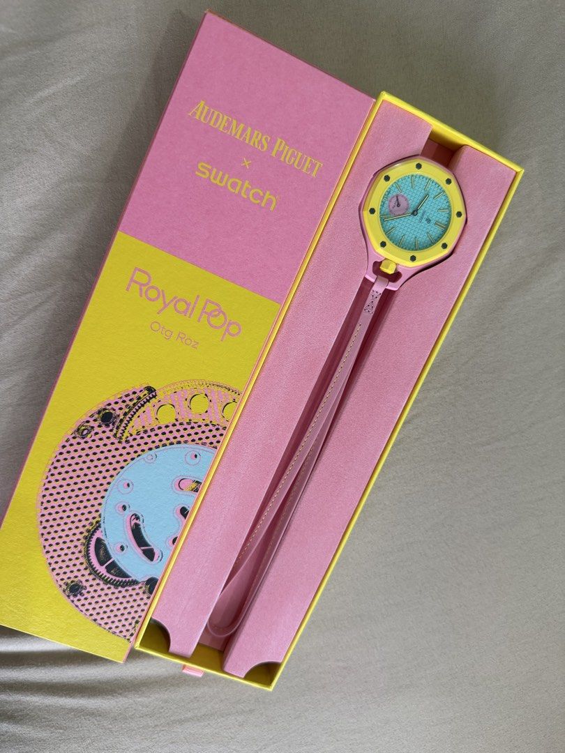 AP x Swatch Royal Pop Otg Roz (Category: Luxury Watches) located in Manila. Submitted by vovochka53 (Listing ID 1470042899, Image 2). Description: - Brand new, unused condition inside original packaging - Audemars Piguet x Swatch Royal Pop in vibrant Otg Roz colourway - Eye-catching bright turquoise textured dial with a bold yellow bezel - Playful pink case and matching strap - Includes special edition pink and yellow presentation box plus white 