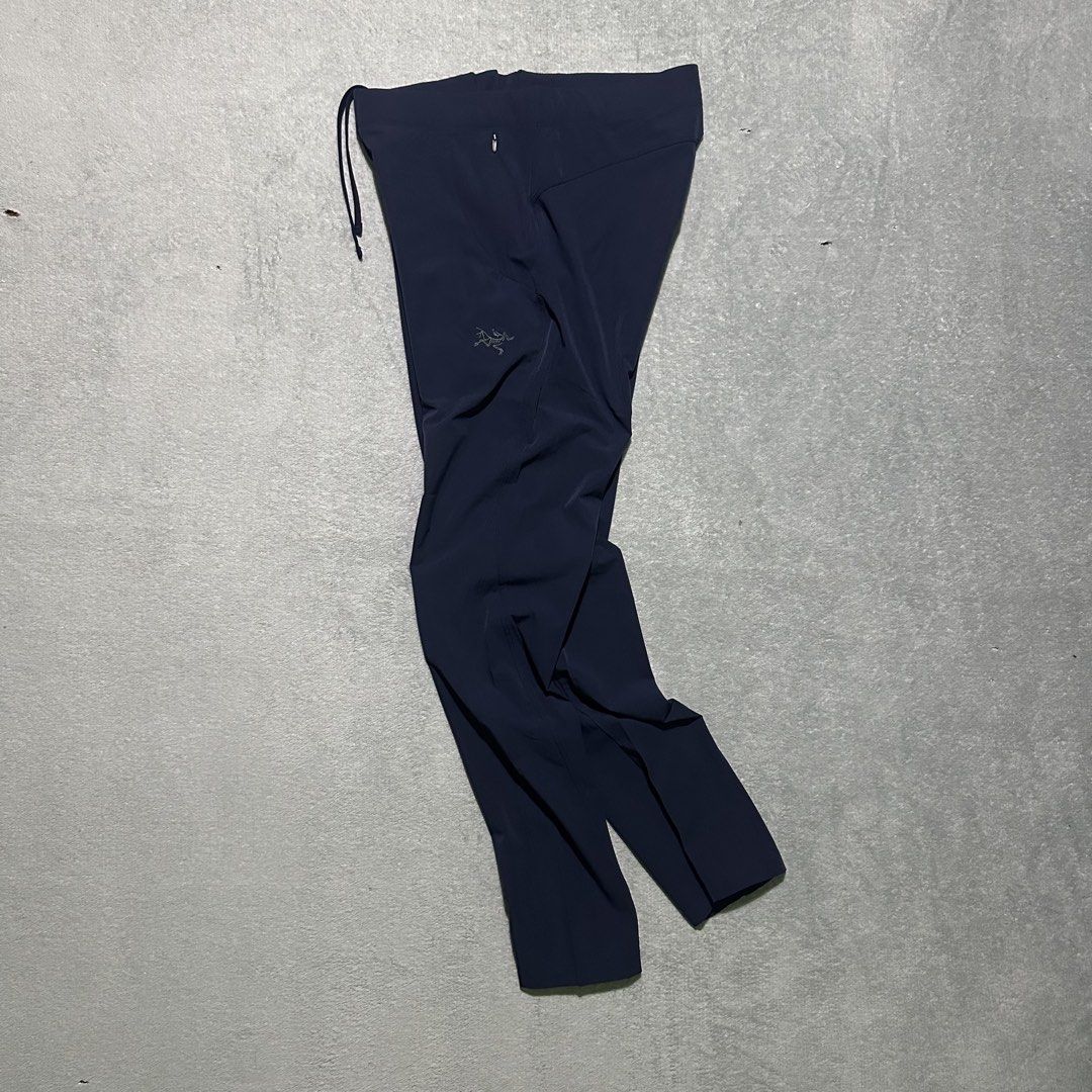 Arc'teryx Technical Outdoor Pants Dark Navy (Category: Trousers) located in Bayombong. Submitted by rochelle_archive_garments (Listing ID 1470040350, Image 1). Description: - Brand: Arc'teryx - Color: Dark Navy - Material: Lightweight, stretchy technical fabric - Waistband: Elastic with integrated drawstring - Pockets: Secure zippered pockets for essentials - Details: Subtle embroidered fossil logo on left thigh - Ideal for: Hiking, climbing, and