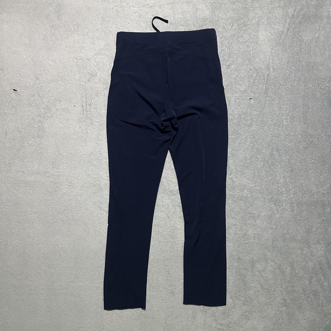 Arc'teryx Technical Outdoor Pants Dark Navy (Category: Trousers) located in Bayombong. Submitted by rochelle_archive_garments (Listing ID 1470040350, Image 3). Description: - Brand: Arc'teryx - Color: Dark Navy - Material: Lightweight, stretchy technical fabric - Waistband: Elastic with integrated drawstring - Pockets: Secure zippered pockets for essentials - Details: Subtle embroidered fossil logo on left thigh - Ideal for: Hiking, climbing, and