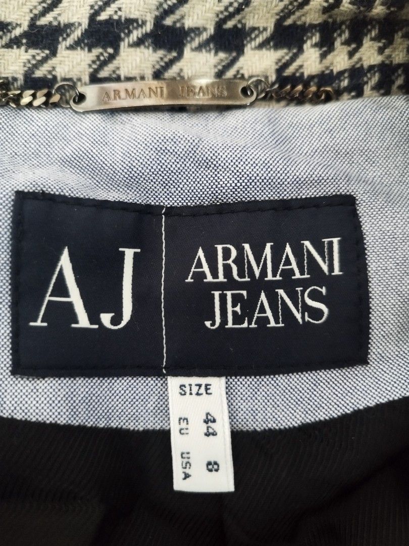 Armani Jeans Black White Houndstooth Blazer Size 44 EU (Category: Coats, Jackets and Outerwear) located in Cavite. Submitted by RAJATREASUREBOX (Listing ID 1470015728, Image 3). Description: - Brand: Armani Jeans - Style: Houndstooth blazer (black and white) - Size: 44 EU / 8 USA fits S-M - Fit: Tailored with structured shoulders - Details: Front button closure, fully lined interior, and metal brand chain at the collar.