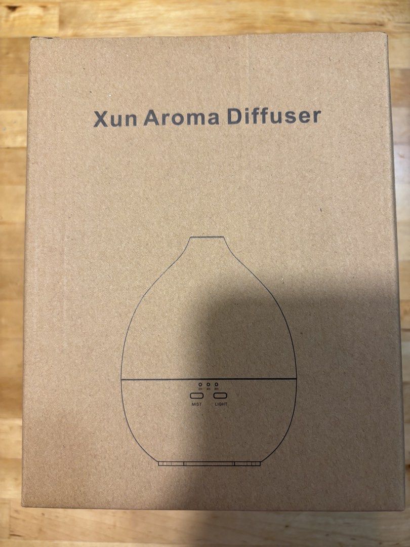 Aroma diffuser (Category: Home Fragrance) located in Singapore. Submitted by bunnyx2 (Listing ID 1470029917, Image 2). Description: - Brand: Xun Aroma Diffuser (Model: JY-022) - Water capacity: 200ml - Features 7 warm LED colors with gradual change or manual selection - Ultrasonic high-frequency vibrations for fine mist fragrance - Working modes: Continuous 2H/4H or intermittent 8H - Safety feature: Waterless automatic power off - Aromatherapy ra