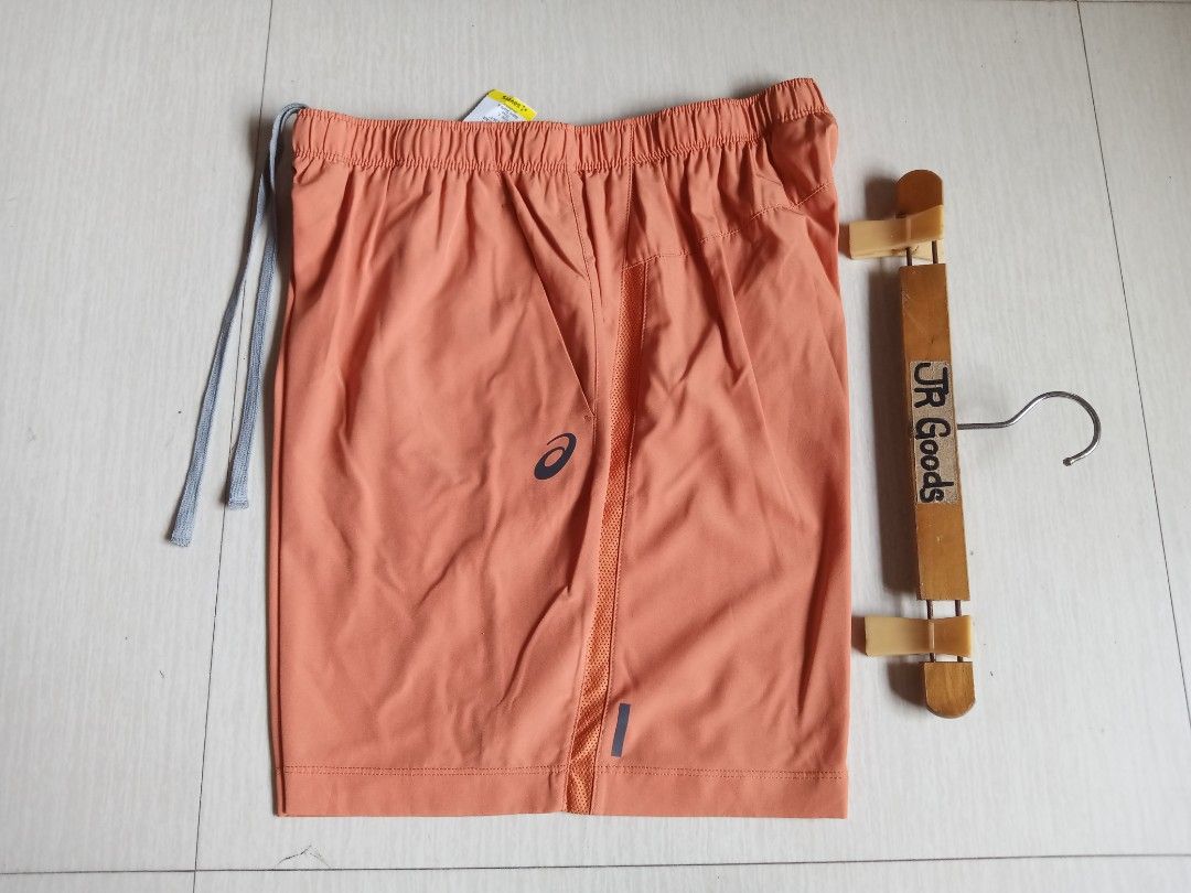 Asics Athletic Running Shorts (Category: Activewear) located in Tanay. Submitted by jrgoods (Listing ID 1469998310, Image 1). Description: Asics running short Best fit medium to large men's above the knee Waistline 30-34 Length 17.5 Good as new condition 599+ship Tanay Rizal location Shipping Nationwide - Color: Vibrant Orange with Grey Drawstring Cords - Material: Main (90% Polyester, 10% Spandex); Inner Insert (80% Polyester, 20% Spandex) - Fea