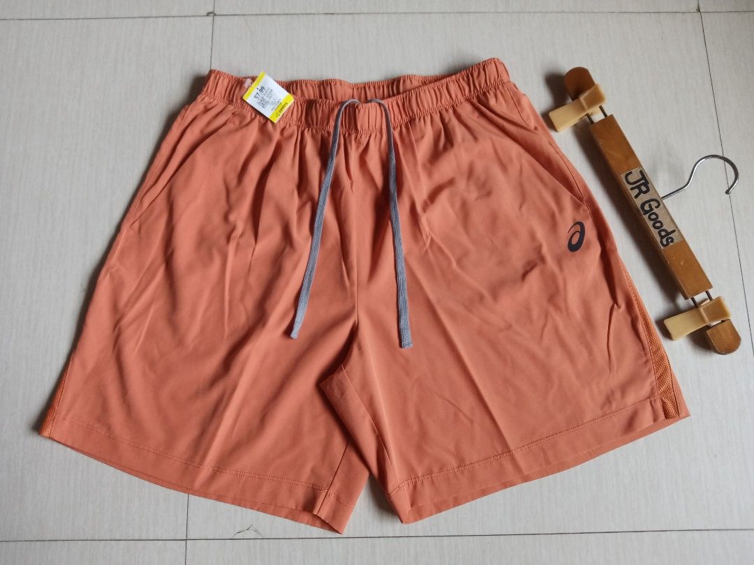 Asics Athletic Running Shorts (Category: Activewear) located in Tanay. Submitted by jrgoods (Listing ID 1469998310, Image 2). Description: Asics running short Best fit medium to large men's above the knee Waistline 30-34 Length 17.5 Good as new condition 599+ship Tanay Rizal location Shipping Nationwide - Color: Vibrant Orange with Grey Drawstring Cords - Material: Main (90% Polyester, 10% Spandex); Inner Insert (80% Polyester, 20% Spandex) - Fea