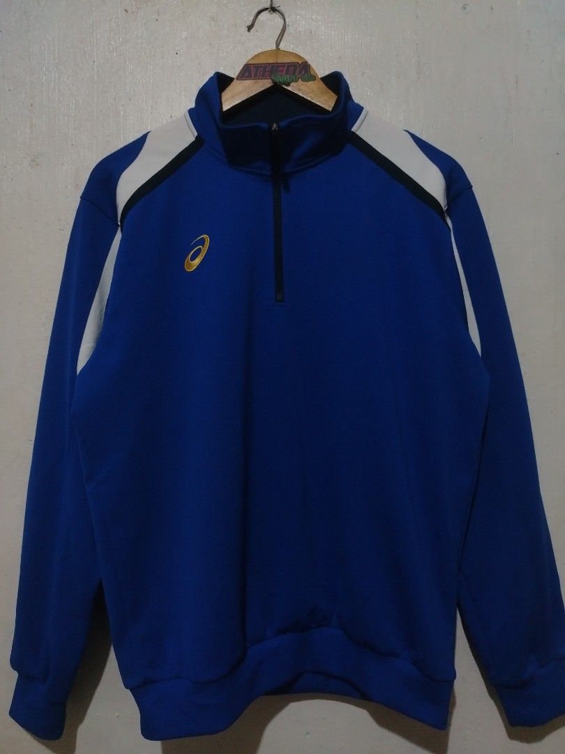 Asics Blue White Quarter Zip Track Jacket (Category: Coats, Jackets and Outerwear) located in Rizal. Submitted by gmpastoffi75031 (Listing ID 1470013581, Image 1). Description: - Brand: Asics - dimes 23x27.5 - Style: Quarter-zip track jacket - Color: Royal blue with white shoulder panels - Details: Gold embroidered chest logo, Asics back collar label, branded zipper pull - Features: High neck collar, ribbed cuffs and hem - Condition: Clean piece 