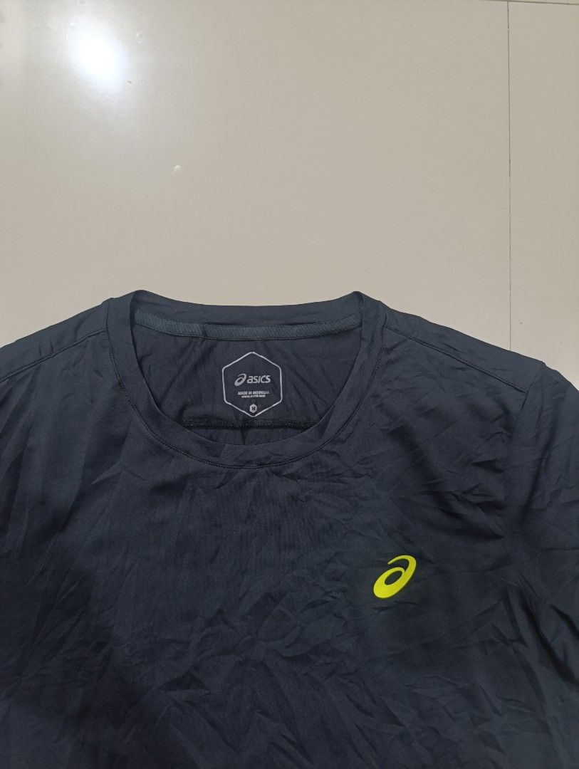 Asics Running T-shirt Size M (Category: Activewear) located in Davao. Submitted by idioticthrifter (Listing ID 1470123231, Image 2). Description: Pre- loved( medjo maliit sakin) - Color: Dark grey with neon yellow accents - Brand: Asics Running (logo on chest, vertical text on back) - Size: 95 (Medium, fits heights 170-180cm) - Material: Lightweight & breathable polyester-polyurethane blend - Origin: Made in Indonesia - Condition: Excellent activ