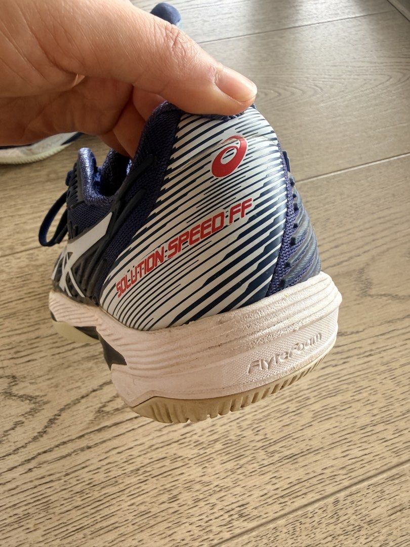 Asics Solution Speed FF Court Shoes (Category: Sneakers) located in San Juan City. Submitted by clever_chic (Listing ID 1469953924, Image 3). Description: - Brand: Asics Court Shoes - Color: Navy blue with white and red accents - Size: US 6.5 / EUR 37.5 - Midsole: FlyFoam for extra bounce and support - Outsole: Excellent grip for court play - Condition: Minor scuffs on midsoles, treads still strong, and clean inner lining.