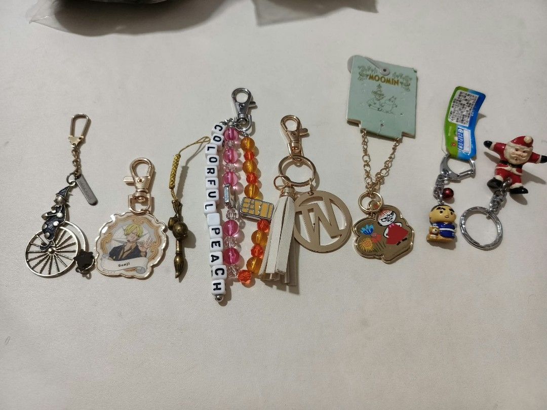 Assorted Anime and Novelty Keychains Lot (Category: Character Goods) located in Abucay. Submitted by thrifty.picked (Listing ID 1470114657, Image 1). Description: - Diverse keychain collection including Sanji (One Piece), Moomin, Santa Claus, a unicycle rider, and colorful letter beads - Made from a mix of durable materials: metal, acrylic, plastic, and fabric - Versatile use: ideal for decorating bags, keys, or lanyards - Bundle deal: grab the w