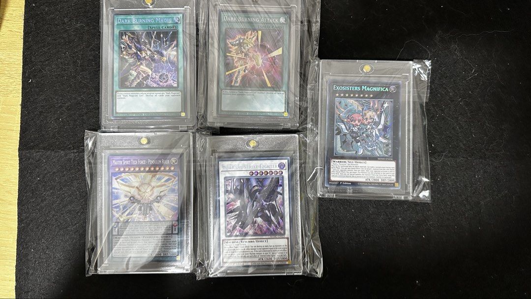Assorted characters M (Category: Raw Singles) located in Bulacan. Submitted by lesgoohtcg (Listing ID 1470125993, Image 1). Description: Assorted Secret rare cards: * Master Spirit Tech Force - Pendulum Ruler * Dark Burning Magic * Infernal Strike Fighter * Dark Burning Attack * Exosisters Magnifica PM for exact price and additional actual photos when ready to deal. Payment first thru Gcash - Same day delivery, shipping via Lalamove, Grab Express