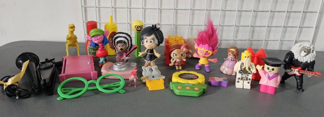 Assorted figures toys miniatures and microphone lot (Category: Figurines & Statues) located in San Jose del Monte. Submitted by stellarbeauty (Listing ID 1470022068, Image 1). Description: - Mixed bundle of assorted plastic toys and miniatures - Includes Trolls characters, Lego minifigures, a Shopkins figure, and a miniature dinosaur - Features fun accessories like a microphone with stand, toy camera, and small playset items - Mixed lot from vari
