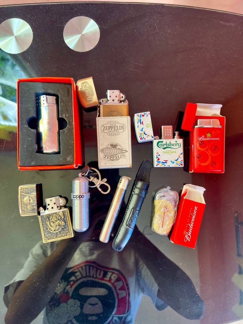 Assorted Lighters Zippo Davidoff Budweiser Carlsberg Zeppelin (Category: Vintage Collectibles) located in Baguio. Submitted by carlbenta (Listing ID 1470081928, Image 1). Description: - Curated collection of lighters and accessories including Zippo models, Davidoff, Carlsberg, Budweiser, and Zeppelin boxed sets - Features diverse designs such as brass wolf engravings, chrome finishes, and promotional beer branding - Includes practical extras like