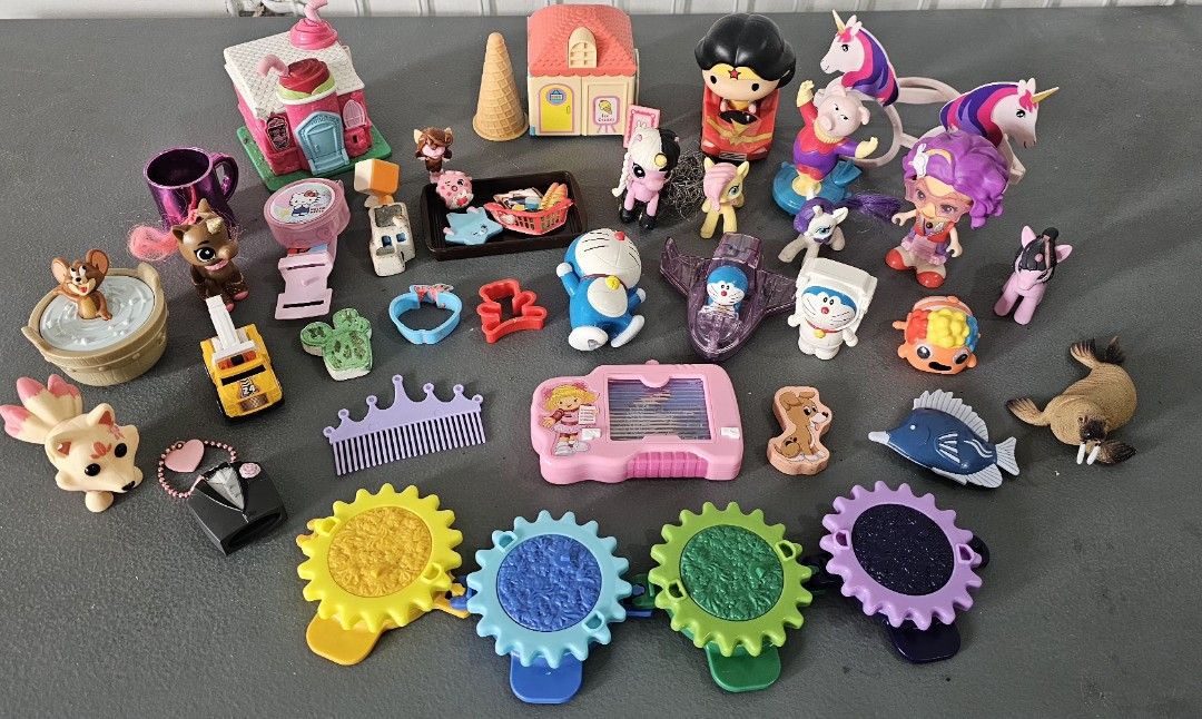 Assorted Miniature Toys Figures and Playset Accessories (Category: Kids Toys) located in San Jose del Monte. Submitted by stellarbeauty (Listing ID 1470015815, Image 1). Description: - Mixed toy bundle, perfect for playtime or collecting - Includes Doraemon figures, Wonder Woman toy, and My Little Pony style unicorns - Features various animals, mini buildings, stamps, and interlocking gear pieces - Comprises lots of small pieces - Sold strictly a