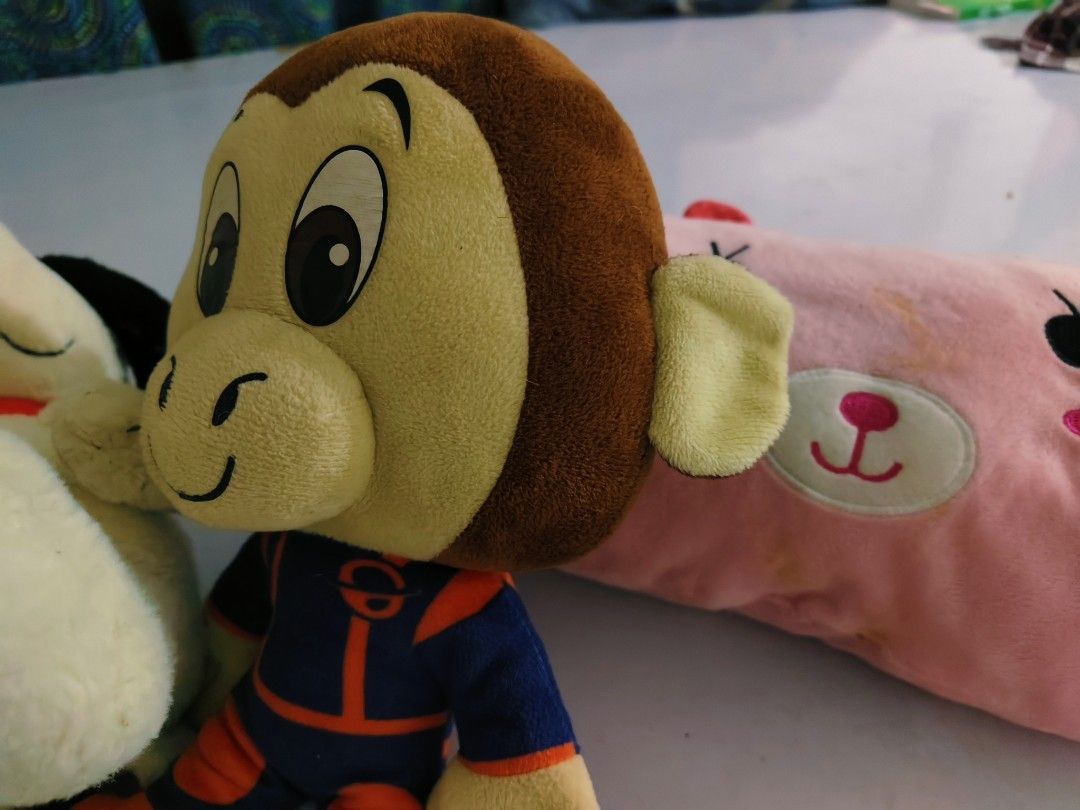 Assorted Plush Toys Snoopy Monkey Pink Bear Bolster (Category: Plushies & Soft Toys) located in Bulacan. Submitted by babz30261 (Listing ID 1470032175, Image 3). Description: - Set of 4 adorable plush toys sold together - Big Snoopy with black ears included - Small Snoopy wearing a red collar - Cartoon monkey in a blue astronaut suit - Pink bear face bolster pillow with red polka dot ears (Note: has some light stains) - Great addition to kids' ro