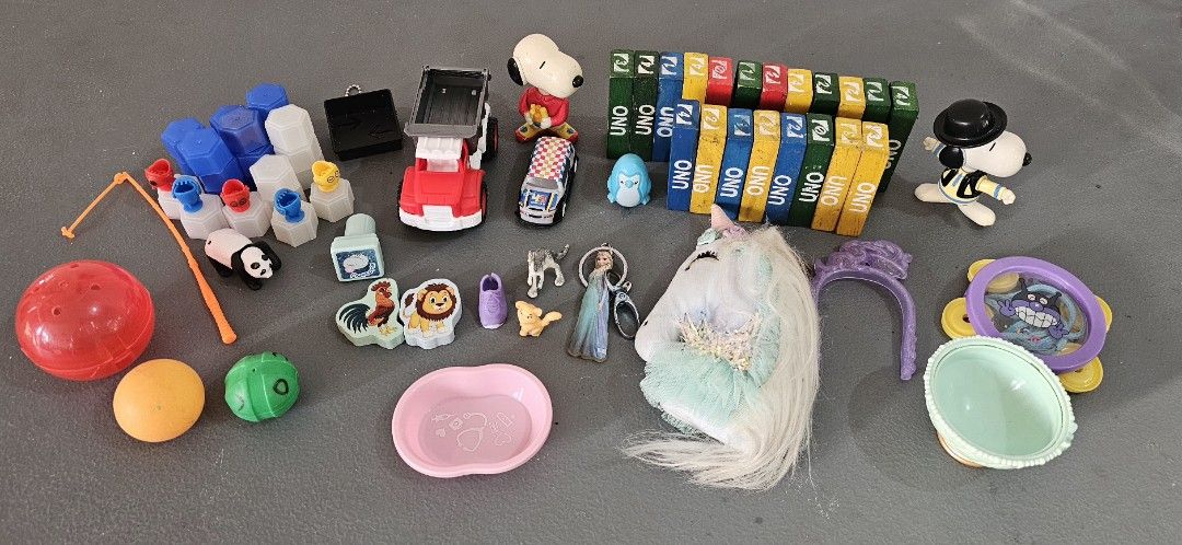 Assorted Toys Figures Snoopy UNO Stacks Unicorn Plush Bundle (Category: Plushies & Soft Toys) located in San Jose del Monte. Submitted by stellarbeauty (Listing ID 1470028674, Image 1). Description: - Assorted toy and game bundle featuring a fun variety of items - Includes Snoopy figurines, UNO stack blocks, and a plush unicorn headpiece - Also comes with small animal figures, a toy truck, a blue penguin, and miniature stamps - Ideal for kids, to