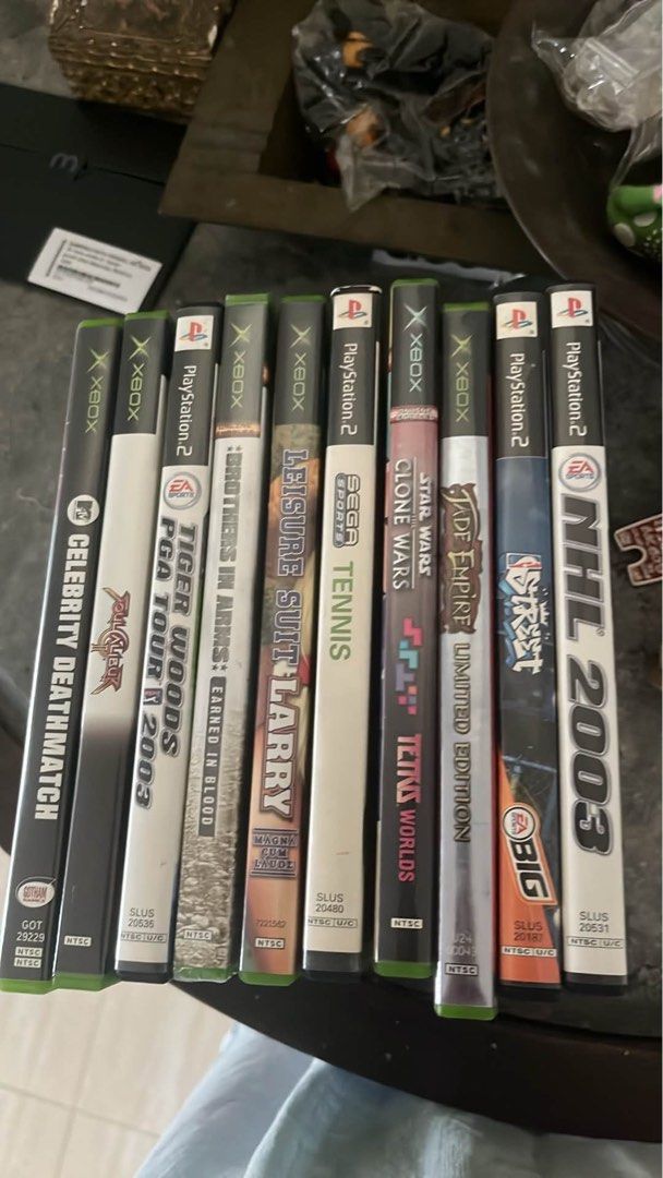 Assorted Xbox and PlayStation 2 Video Games Lot (Category: PlayStation) located in Marikina City. Submitted by twice-nicee (Listing ID 1469981852, Image 1). Description: - Xbox & PS2 10-Game Bundle - Includes: Celebrity Deathmatch, Tiger Woods 2003, Brothers in Arms, Leisure Suit Larry, Sega Sports Tennis, Star Wars Clone Wars Tetris Worlds, Jade Empire Limited Edition, NFL Street, and NHL 2003 - Great mix of sports, action, and retro classics - 