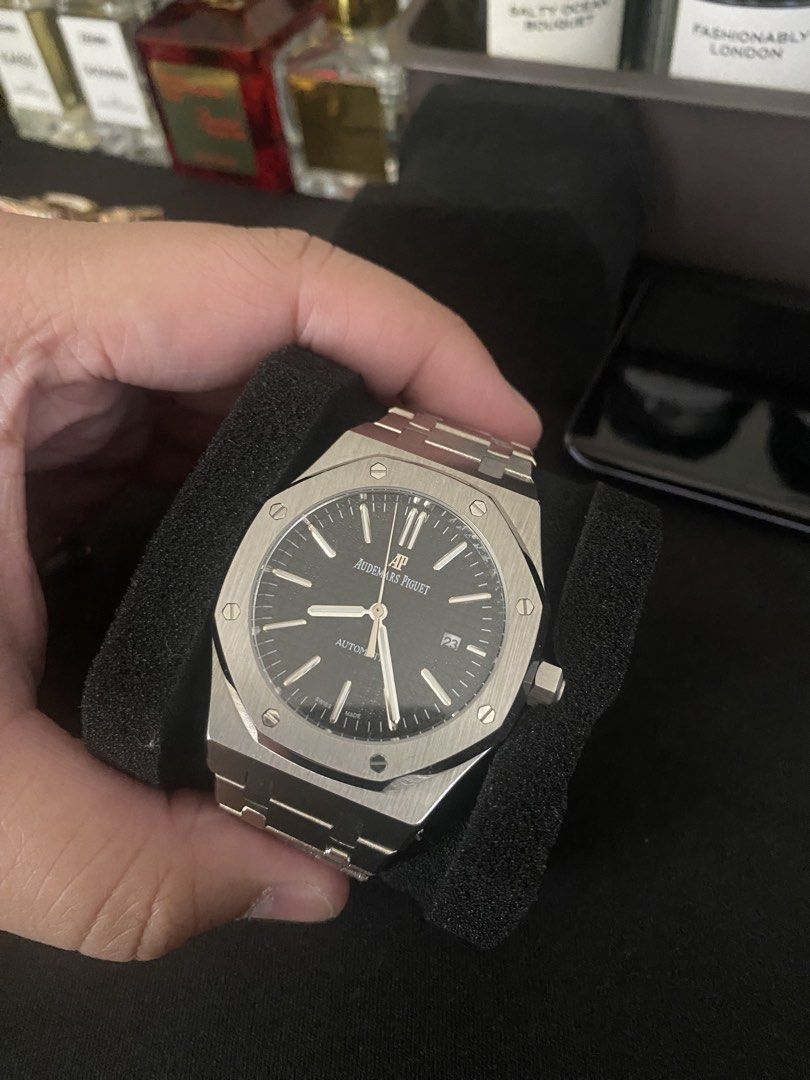 Audemars Piguet Royal Oak Automatic Watch (Category: Luxury Watches) located in Quezon City. Submitted by qiaoang (Listing ID 1469961354, Image 1). Description: - Brand: Audemars Piguet Royal Oak - Movement: Automatic with decorated gold rotor (exhibition caseback) - Material: Stainless steel case and integrated bracelet - Dial: Black textured dial with baton markers and date window at 3 o'clock - Clasp: Signed deployant clasp with AP logo - Cond