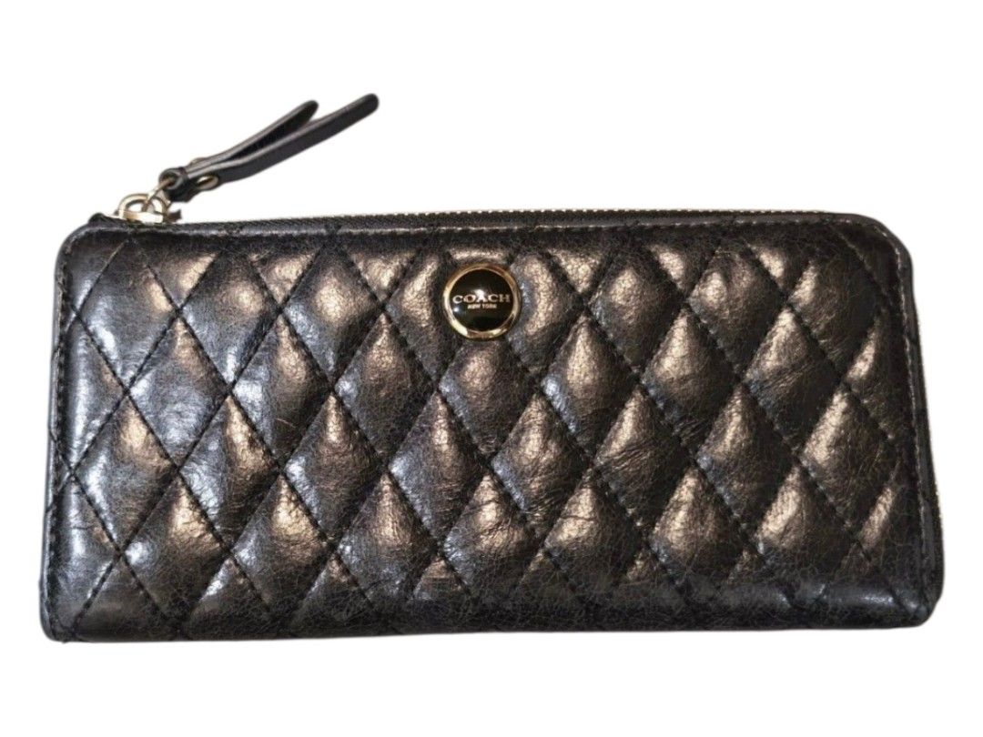 AUTH COACH BLACK QUILTED LEATHER ZIP WALLET (Category: Wallets & Card holders) located in Baguio. Submitted by zia_zab (Listing ID 1470006663, Image 1). Description: - Brand: Coach - Color: Classic Black - Material: Premium quilted leather with chic diamond stitching - Hardware: Elegant gold-toned logo plaque and sturdy zippers - Closure: Secure zip-around with a matching leather pull tab - Interior: Smooth black leather lining - Design: Compact 
