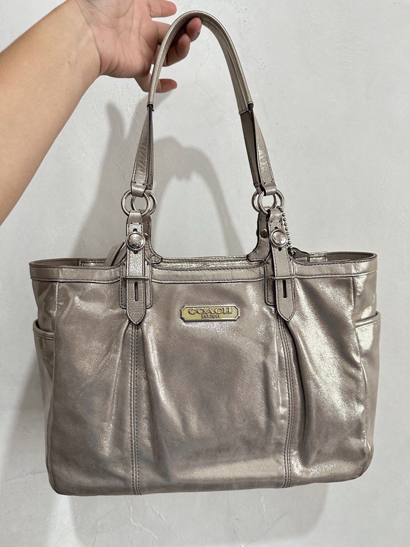 ⁠Authentic Coach Metallic Fabric / Canvas Tote Bag⁠ (Category: Shoulder Bags) located in Manila. Submitted by emily.santiago (Listing ID 1469974729, Image 1). Description: AUTHENTIC COACH METALLIC LEATHER TOTE BAG Classy and spacious Coach tote in a chic metallic finish with signature gold-tone “COACH EST. 1941” hardware plaque! Perfect for daily use, work, or casual outings. Product Details: Brand: Coach Material: Metallic Woven Fabric / Coated 