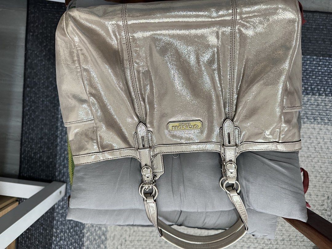 ⁠Authentic Coach Metallic Fabric / Canvas Tote Bag⁠ (Category: Shoulder Bags) located in Manila. Submitted by emily.santiago (Listing ID 1469974729, Image 2). Description: AUTHENTIC COACH METALLIC LEATHER TOTE BAG Classy and spacious Coach tote in a chic metallic finish with signature gold-tone “COACH EST. 1941” hardware plaque! Perfect for daily use, work, or casual outings. Product Details: Brand: Coach Material: Metallic Woven Fabric / Coated 