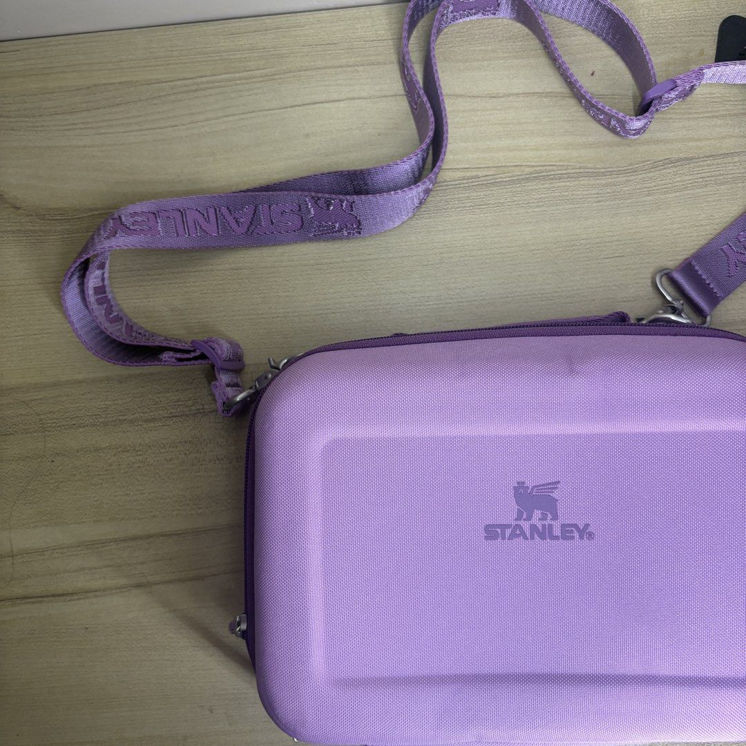 Authentic Stanley Purple All Day Lunch Box (Category: Cross-body Bags) located in Angeles City. Submitted by muse_archive (Listing ID 1470045702, Image 2). Description: - Brand new!! -with adjustable strap The All Day Lunch Box holds your lunch at the right temp for hours thanks to molded EVA insulation. The crush resistant EVA body holds its shape. An inner mesh pocket stores your silverware and a small snack. - with original tag, care booklet, 