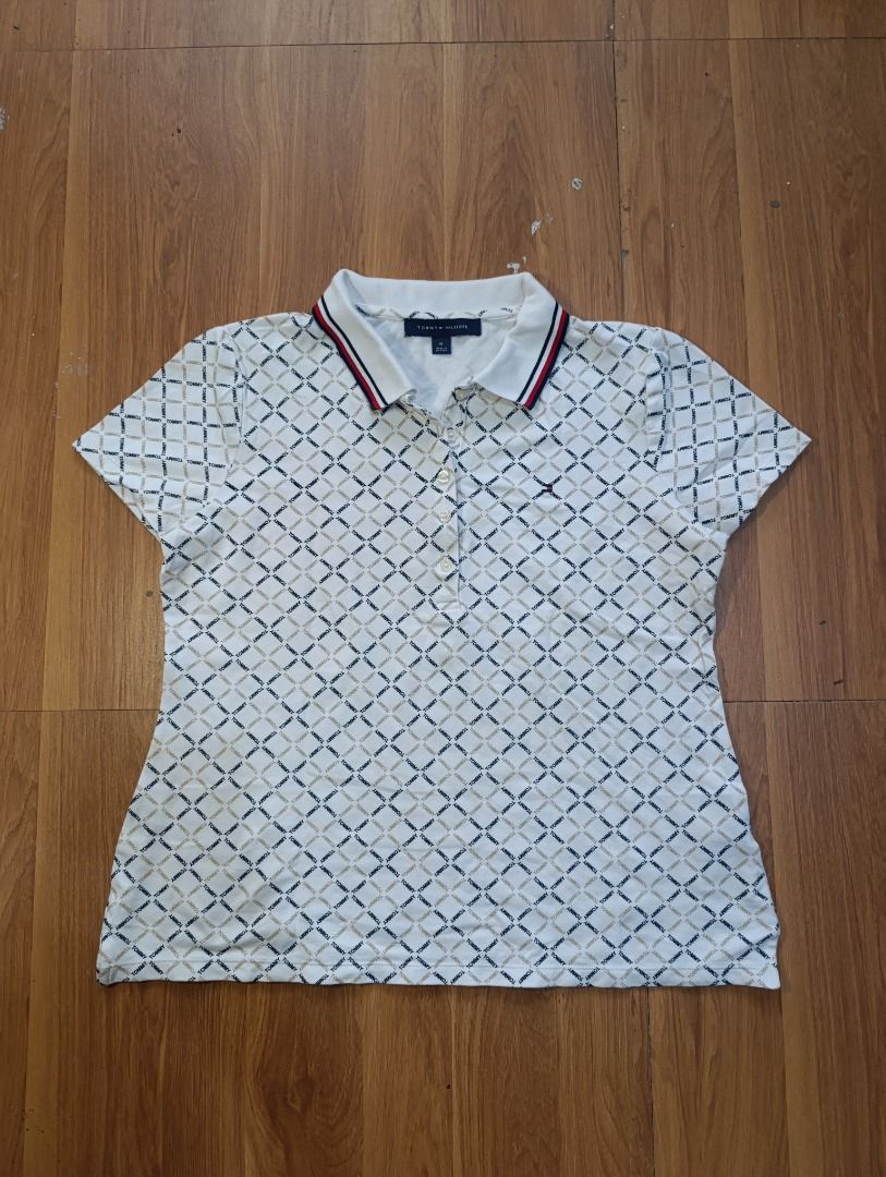 Authentic Tommy Hilfiger AOP Polo Shirt (Category: Others Tops) located in Bulacan. Submitted by koritoo (Listing ID 1470006103, Image 1). Description: Authentic Tommy Hilfiger AOP Polo Shirt Good as new no issue Size M Dimensions: 19 Width 18.5 Waist 22 Length Color rate: 10/10.