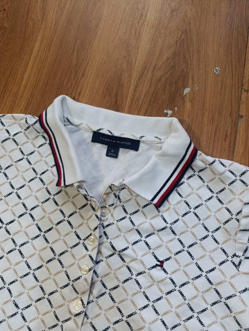Authentic Tommy Hilfiger AOP Polo Shirt (Category: Others Tops) located in Bulacan. Submitted by koritoo (Listing ID 1470006103, Image 2). Description: Authentic Tommy Hilfiger AOP Polo Shirt Good as new no issue Size M Dimensions: 19 Width 18.5 Waist 22 Length Color rate: 10/10.
