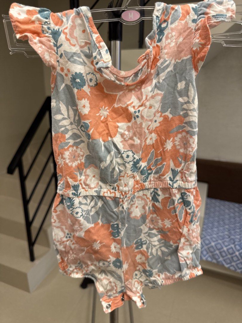 Baby floral romper 18M (Category: Babies & Kids Fashion) located in Manila. Submitted by __nix (Listing ID 1470005981, Image 2). Description: - Adorable peach and grey floral print - Size: 18 months - Material: 100% soft and breathable cotton - Features cute flutter sleeves and an elastic waistband - Convenient bottom snap buttons for quick and easy diaper changes.