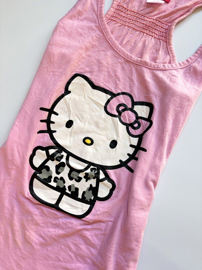 baby pink hello kitty tank top (Category: Sleeveless) located in Tarlac. Submitted by pearl_xoxo (Listing ID 1470108246, Image 2). Description: - baby pink hello kitty tank top bust: 15” waist: 14 1/2” length: 23” size: m-l issue: needwash brand: hello kitty .
