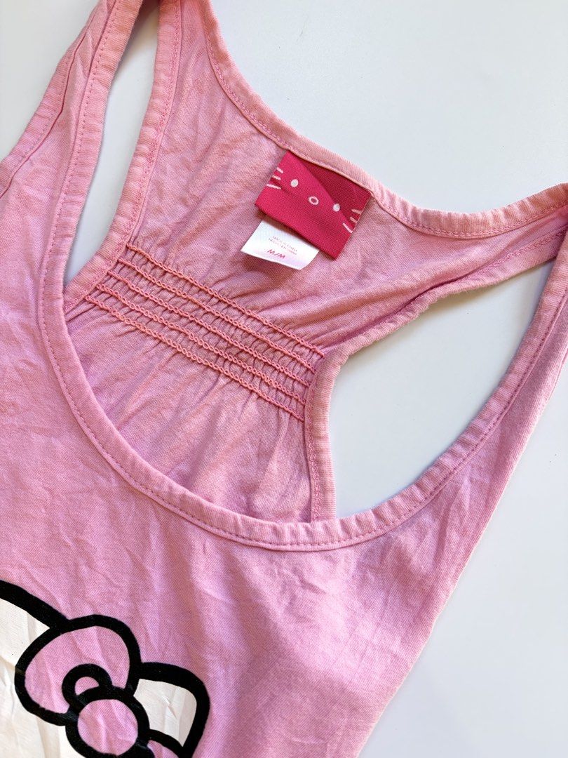baby pink hello kitty tank top (Category: Sleeveless) located in Tarlac. Submitted by pearl_xoxo (Listing ID 1470108246, Image 3). Description: - baby pink hello kitty tank top bust: 15” waist: 14 1/2” length: 23” size: m-l issue: needwash brand: hello kitty .