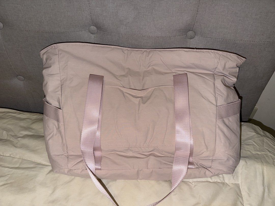 Bagsmart Pink Tote Bag (Category: Tote Bags) located in General Trias. Submitted by tmbychc (Listing ID 1470077567, Image 2). Description: BRAND NEW! Never been used, with tags still attached and with plastic (opened) - Large main compartment with zipper closure, multiple pockets - Fits a 15.6 inch laptop - Side pockets, can fit water bottle, umbrellas - Extra straps for yoga mat (removable) location: General Trias, Cavite lamove or ggx.