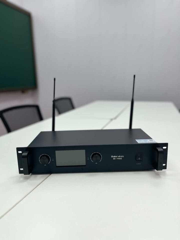 Baiervires BS-7400S Wireless Microphone Receiver (Category: Soundbars, Speakers & Amplifiers) located in Paranaque City. Submitted by digitalconcept.corp (Listing ID 1469969137, Image 1). Description: - Model: Baiervires BS-7400S wireless receiver unit in a sleek black rackmount chassis - Display & Controls: Front display panel equipped with intuitive rotary control knobs and power switch - Antennas: Includes dual antennas securely mounted on the