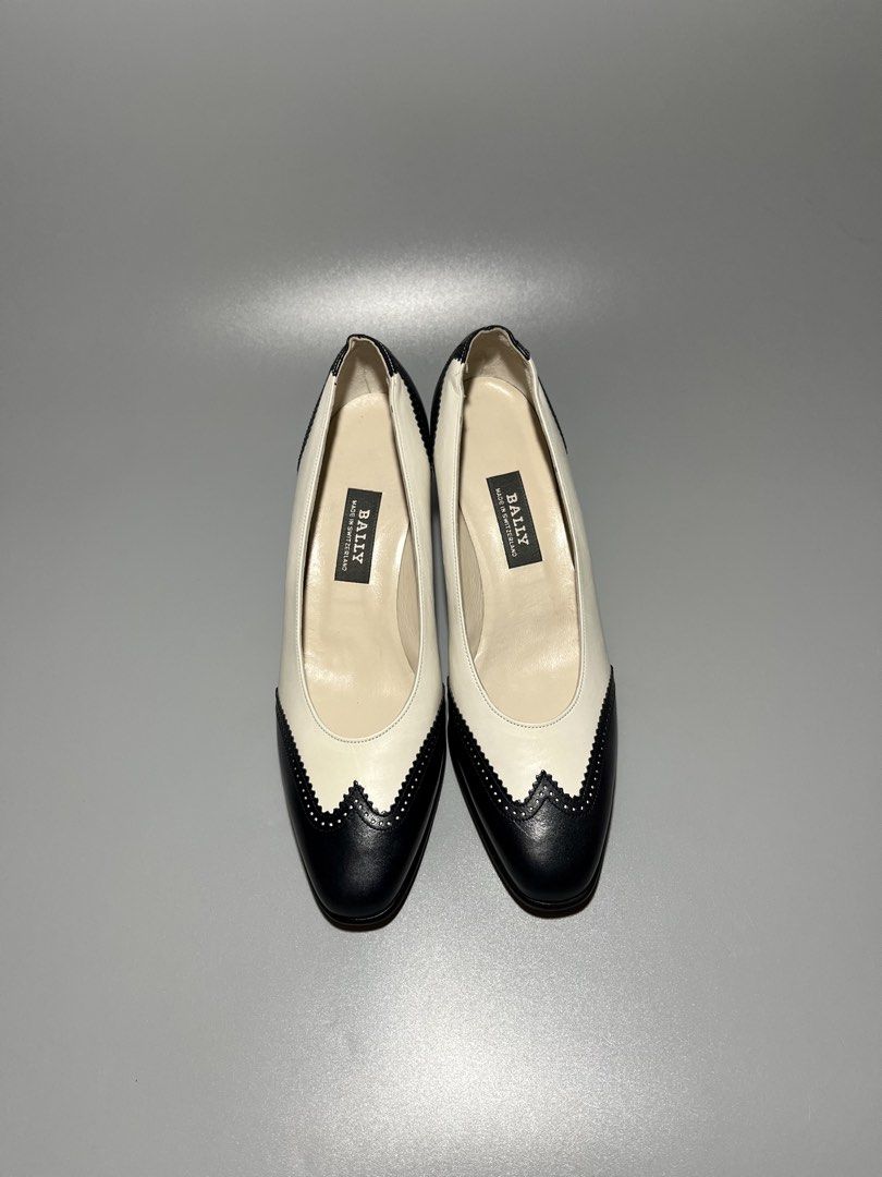 Bally "Vasano" Spectator Pumps (Category: Heels) located in Caloocan City. Submitted by jvn_23 (Listing ID 1470063216, Image 2). Description: Bally “Vasano” Spectator Pumps Authentic/Legit💯 Excellent Condition 📍 No issue❗️ Color rate: 10/10📍 Size: US 7 / EU 38 These vintage Bally “Vasano” spectator pumps feature an elegant cream leather silhouette contrasted by a scalloped, micro-perforated black wingtip toe cap and traditional Swiss-made bran