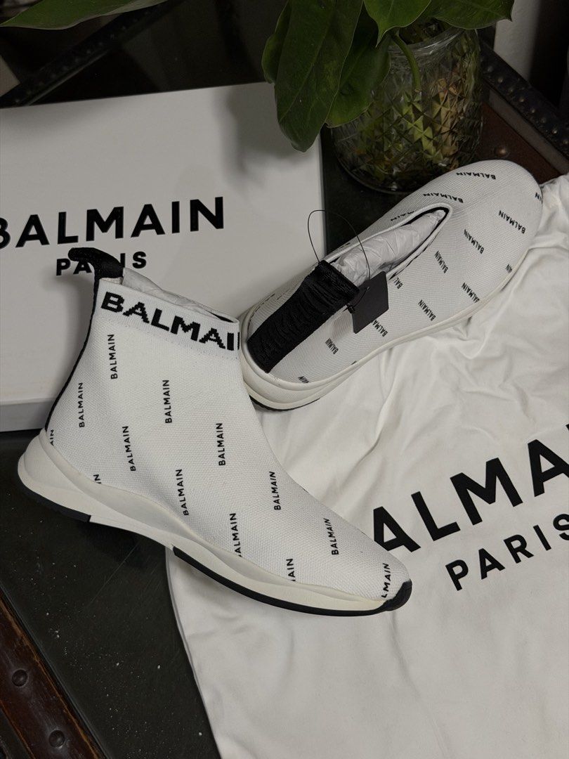 Balmain Monogram Sock Sneakers White Black (Category: Sneakers) located in Marilao. Submitted by lindyaneza (Listing ID 1469953778, Image 1). Description: - Brand: Balmain - Style: High-top sock sneakers - Color: White with all-over black logo print - Features: Pull-on style, black ribbed heel pull tabs, thick white rubber sole with black outsole - Condition: Unworn / Brand New - Inclusions: Original dust bag and branded box included - Shipping: 
