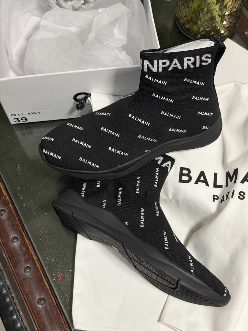 Balmain Paris Black Monogram Sock Sneakers Size 39 (Category: Sneakers) located in Marilao. Submitted by lindyaneza (Listing ID 1469953442, Image 1). Description: - Brand: Balmain Paris - Item: Black sock sneakers with white monogram print - Size: 39 (indicated on box) - Condition: Brand new, unworn, pristine inside box - Features: Stretch knit upper, thick black sole, lightweight slip-on design - Inclusions: Original white dust bag and branded s