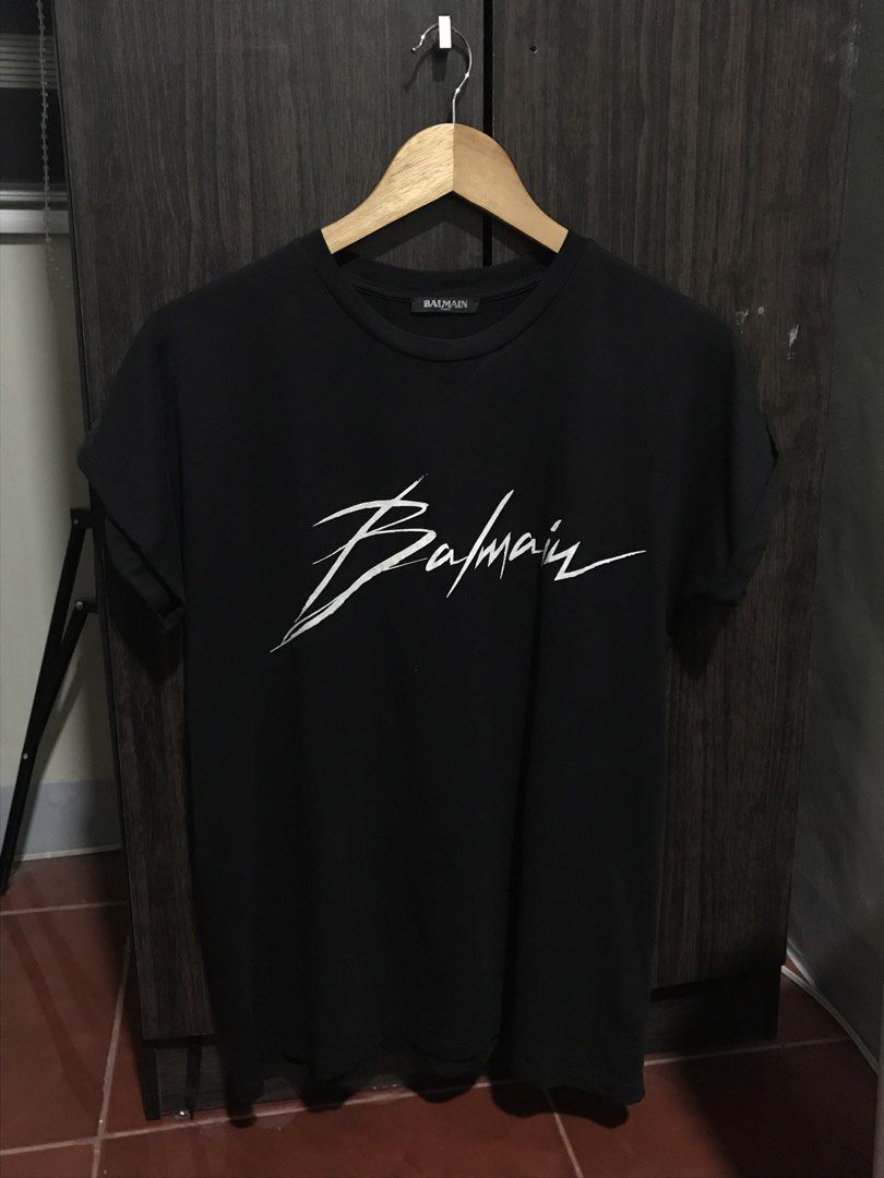 Balmain Paris Signature Logo Shirt (Category: Luxury Apparel) located in Bulacan. Submitted by dailybumps (Listing ID 1470036507, Image 2). Description: 21x26 Authentic No issue This is a Balmain Signature Logo Shirt featuring a white handwritten-style Balmain script logo on the chest..