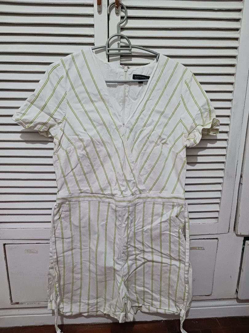 Banana Republic Striped Romper Size 16 Long (Category: Rompers) located in Quezon City. Submitted by rdonelle (Listing ID 1470083361, Image 2). Description: - Brand: Banana Republic - Style: White romper with yellow vertical stripes - Features: V-neck wrap front, short sleeves, built-in waist tie, back zipper closure - Size: 16 Long - Condition: Clean fabric, no flaws spotted, great for warm days.