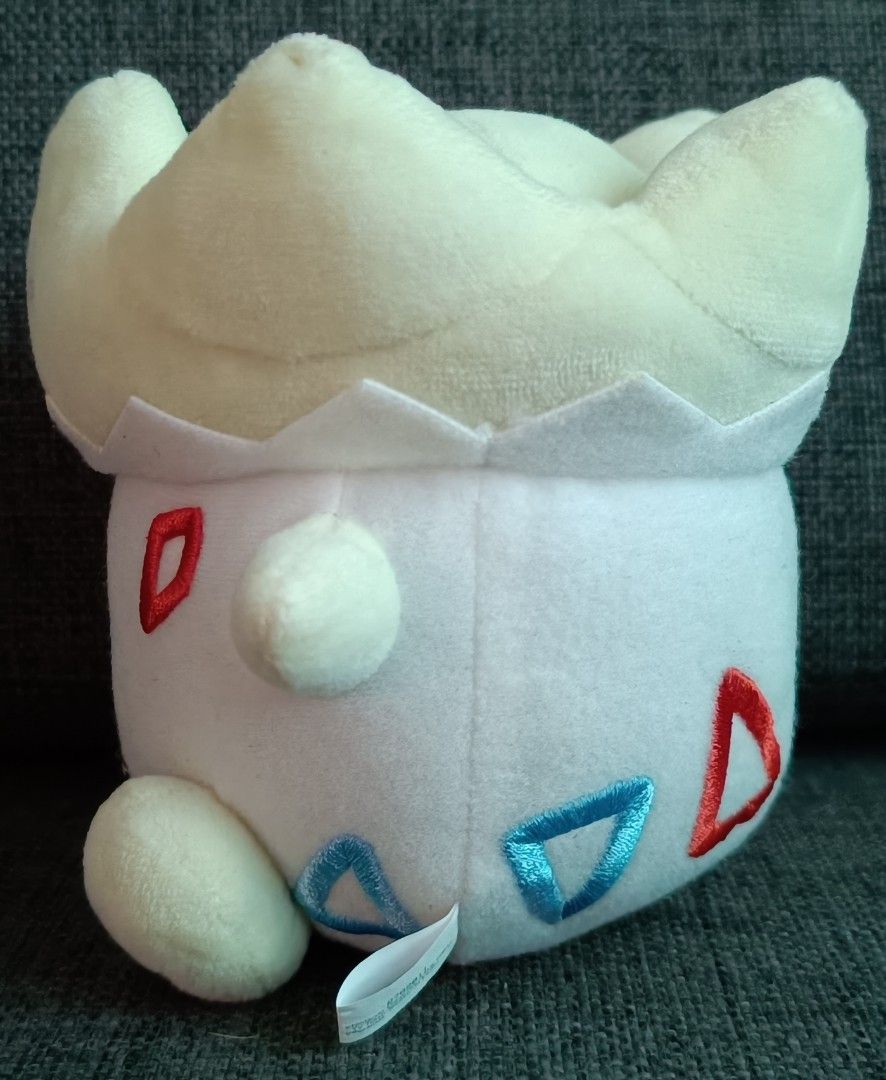 Banpresto Pokémon Togepi Plush (Category: Plushies & Soft Toys) located in San Pedro. Submitted by max__collectibles (Listing ID 1470128061, Image 2). Description: - Official Banpresto Pokémon Togepi plush - Measures 5 inches tall - Features embroidered face, blue belly marking, and red accents - Made with soft, huggable fabric - Includes original Bandai Spirits tush tag.