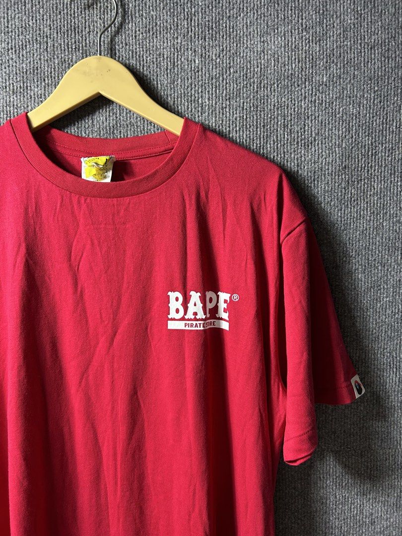 BAPE PIRATES TEE (Category: Activewear) located in Manila. Submitted by cy_bakz (Listing ID 1470101877, Image 1). Description: GUARANTEED AUTHENTIC MENS / -BAPE PIRATES TEE- (RED) SIZE :LARGE ON TAG (Mens) LENGTH : 28 WIDTH : 22 (MEASURED IT BY INCHES) COLOR RATE - 9.8/ 10 OVER ALL CONDITION - 9.8/ 10 IN EXCELLENT CONDITION NO FLAWS / ISSUES (NEED WASH ONLY) ₱ 📩📥 PRICE • Slightly Negotiable • Bacolod City meet up for checking • Open for COD aro