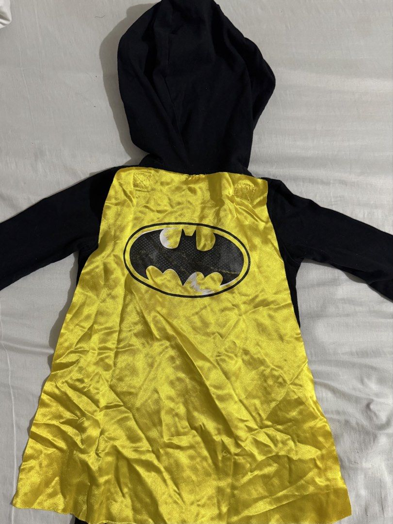 Batman Baby Costume (Category: Babies & Kids Fashion) located in Paranaque City. Submitted by april_anythingpreloved (Listing ID 1470098020, Image 3). Description: - Style: Black Batman infant romper with hood, bat ears, and attached yellow cape - Features: Printed chest armor and utility belt graphic - Convenience: Front zip closure for easy changing - Size: 18 Months - Perfect for: costumes, or parties - Bought in the US - RFS: Decluttering - L