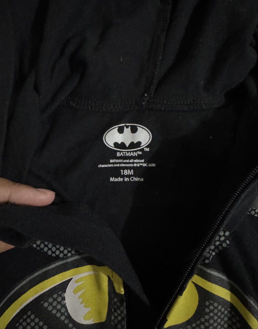 Batman Baby Costume (Category: Babies & Kids Fashion) located in Paranaque City. Submitted by april_anythingpreloved (Listing ID 1470098020, Image 2). Description: - Style: Black Batman infant romper with hood, bat ears, and attached yellow cape - Features: Printed chest armor and utility belt graphic - Convenience: Front zip closure for easy changing - Size: 18 Months - Perfect for: costumes, or parties - Bought in the US - RFS: Decluttering - L