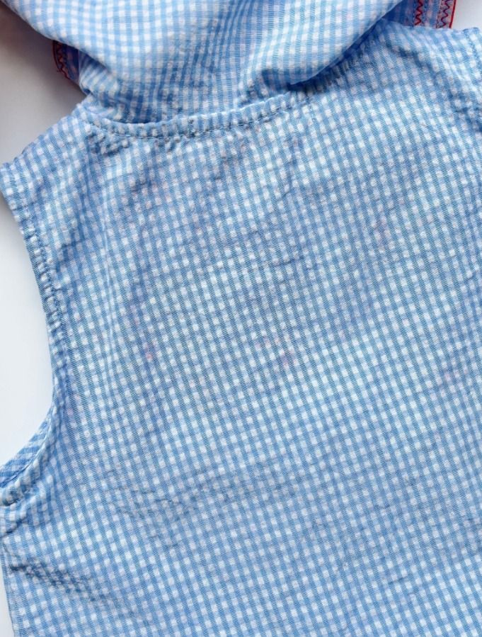 Bebe De Pino Blue Gingham Sailor Dress with Bunny Patch (Category: Babies & Kids Fashion) located in Davao. Submitted by epicdeer.54cf0e (Listing ID 1470092065, Image 3). Description: - Brand: Bebe De Pino - Size: 90 - Color: Light blue and white checkered - Design: Sailor collar with red edging, double-breasted buttons, and an adorable rabbit patch - Style: Sleeveless with a playful pleated skirt - Condition: Has some red color transfer on the c